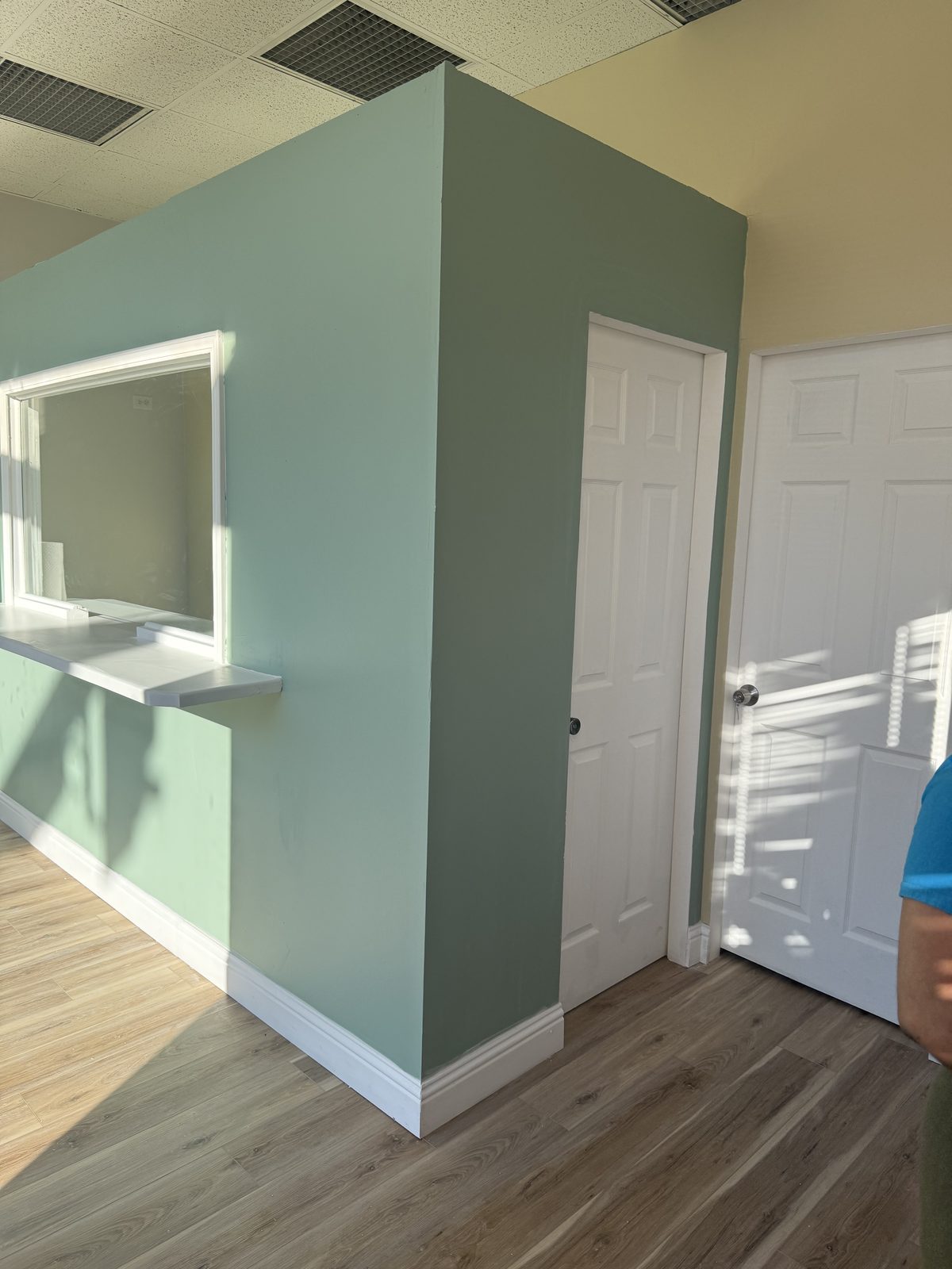 Interior remodel with a painted accent wall and hardwood floors