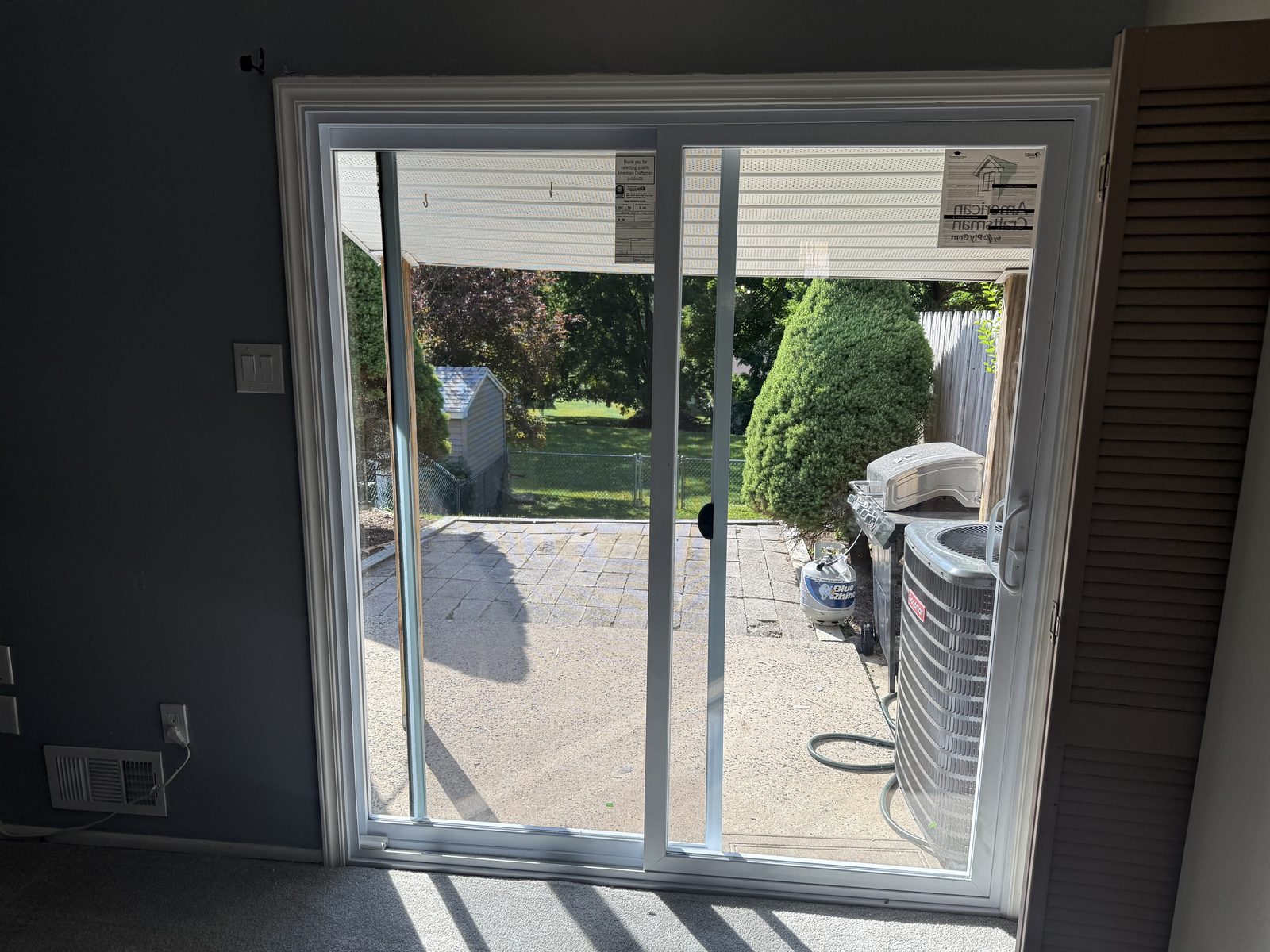 New sliding patio door, interior view to the backyard